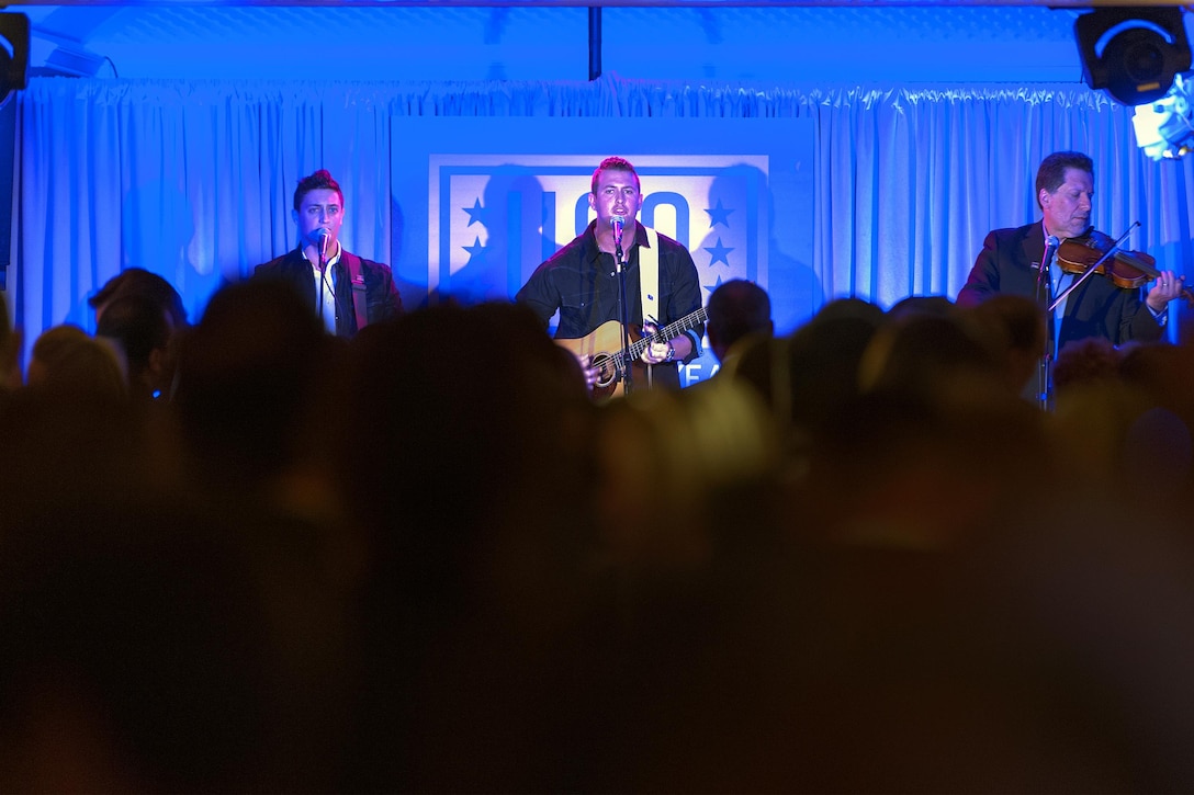 Country music band Interstate 10, headed by active-duty Army Rangers Justin Wright and Andrew Yacovone, performs during the USO 75th anniversary reception in Washington, D.C., Feb. 4, 2016. DoD photo by Navy Petty Officer 2nd Class Dominique A. Pineiro