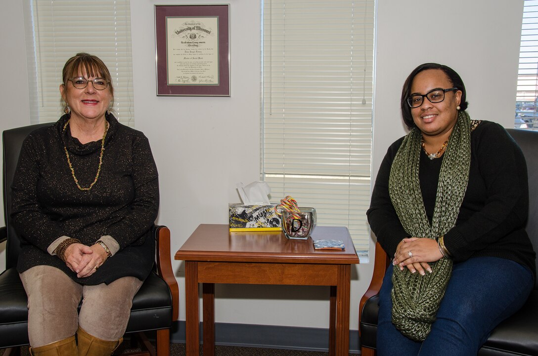 131st Bomb Wing’s Dana Livsey, director of psychological health, (left) and Ivory Jamerson, family readiness coordinator, recently joined the wing in support of its Citizen-Airmen and their families. (U.S. Air National Guard photo by Airman 1st Class Halley Burgess)
