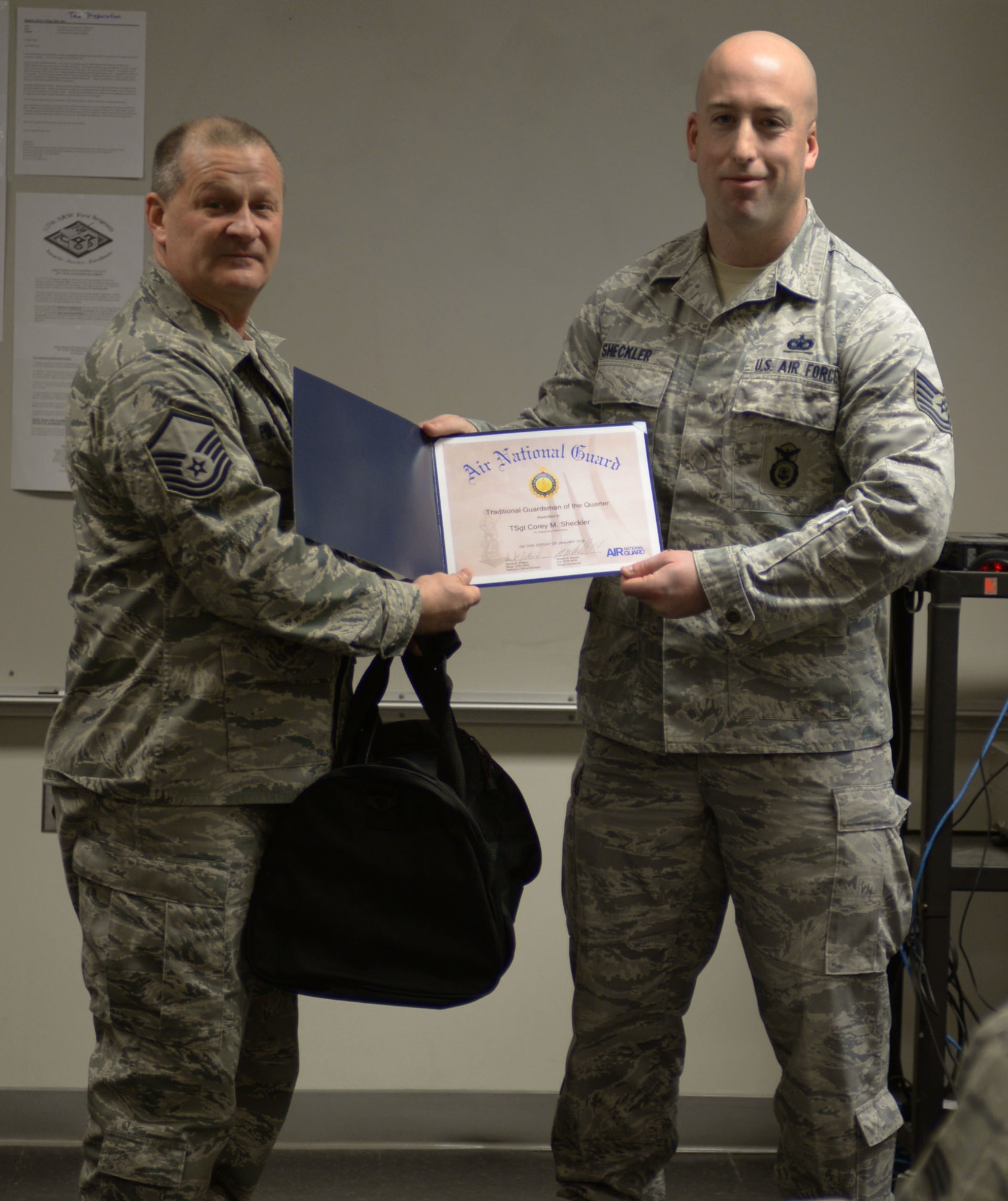 Tech Sgt. Corey Sheckler, 157th Security Forces Fire team leader and Honor Guard member, was named the New Hampshire Air National Guard Traditional Guard Person of the Quarter during the 157 SFS roll call, Pease Air National Guard Base, N.H.,  January 2, 2016. (U.S. Air National Guard photo by Senior Airman Kayla McWalter) 