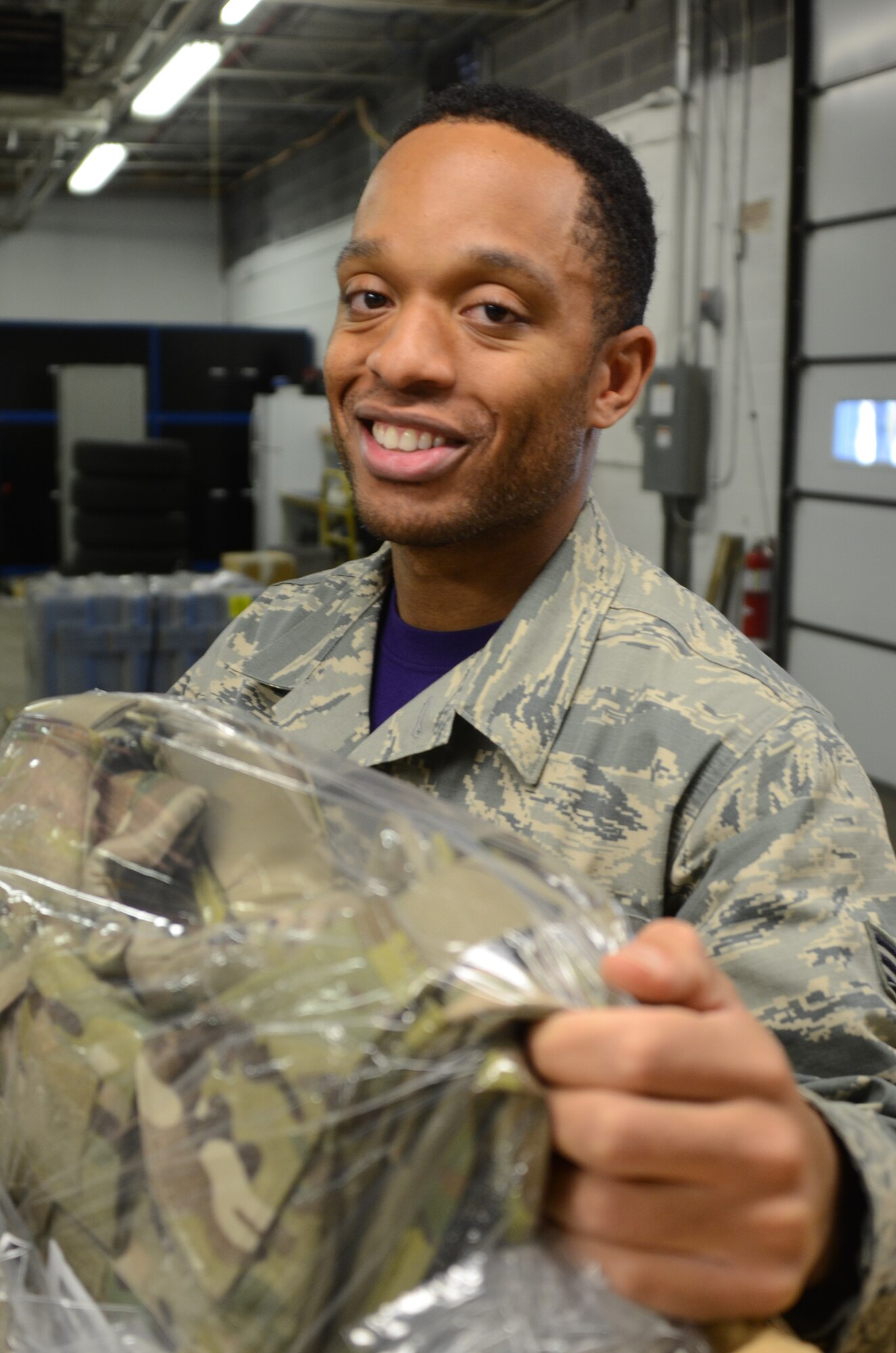 Senior Airman William Greene IV, assigned to the traffic management office,175th Logistic Readiness Squadron, unpacks new Air Force equipment at Warfield Air National Guard Base in Baltimore Dec. 4, 2015. Green, who processes inbound parcels for the entire base, was selected as the Spotlight Airman for the month of February in the Maryland Air National Guard.(U.S. Air National Guard photo by Tech. Sgt. David Speicher/RELEASED)