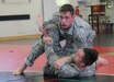 KAISERSLAUTERN, Germany-Center top, Staff Sgt. Joshua Barnes grapples with Spc. Bryan Hauenstein during battle drills at the 7th Mission Support Command led tactical combatives course Feb. 4, 2016 at Kleber Fitness Center. Barnes and Hauenstein, both members of the 92nd Military Police Company as well as other students from around the Kaiserslautern Military Community were participating in the culminating event of a two-week long tactical combatives training.