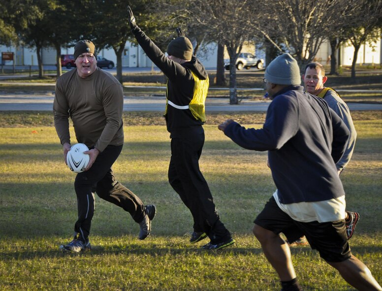 Members of the Air Force Special Operations Air Warfare Center joined 919th Special Operations Wing Airmen in the near freezing temperatures for an ultimate rugby team-building event at Duke Field, Fla., Feb. 5.  (U.S. Air Force photo/Dan Neely)