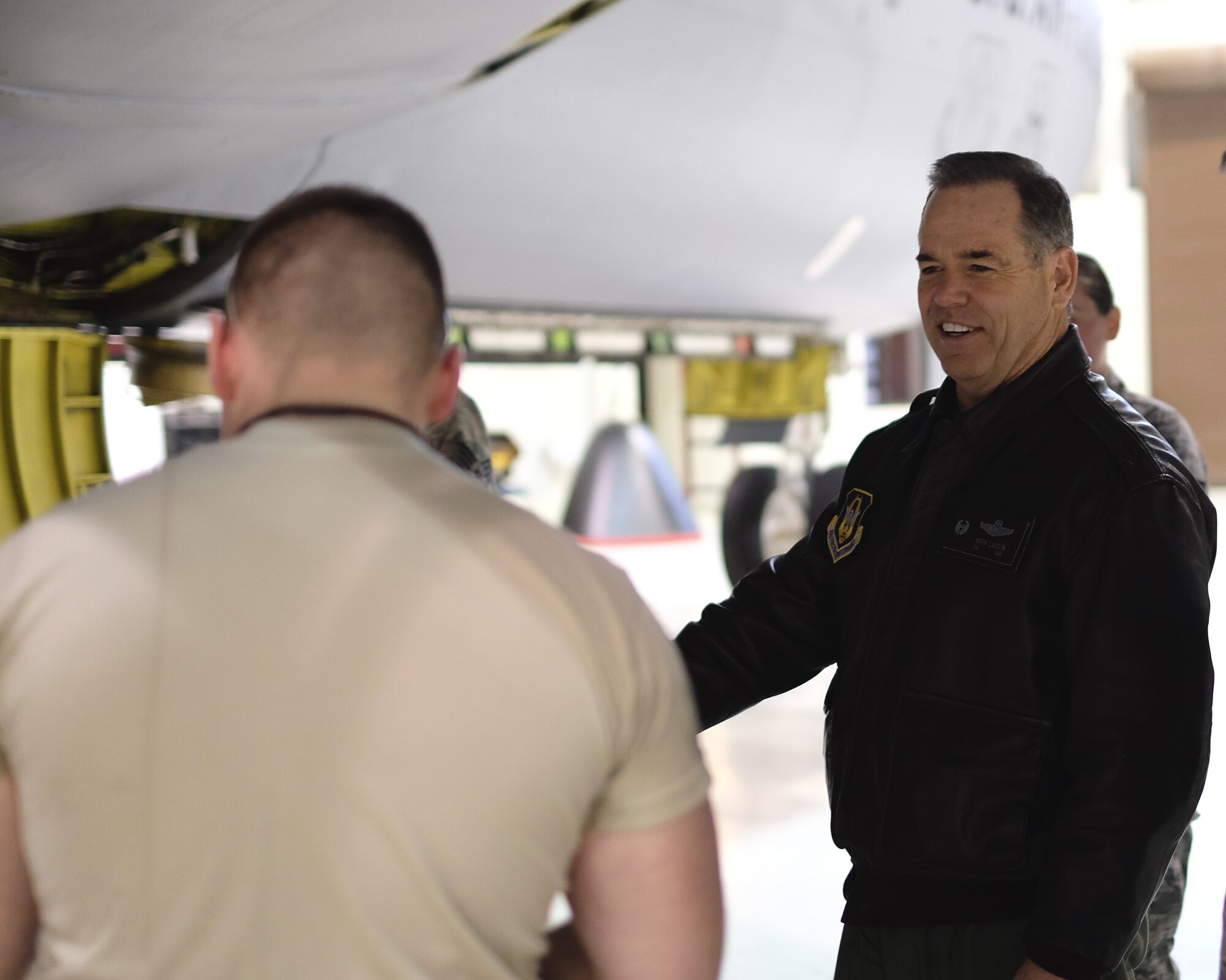 Col. Mark S. Larson, 931st Air Refueling Group commander, meets with Airmen in the 931st Maintenance Squadron during a Unit Training Assembly Feb. 7, 2016, at McConnell Air Force Base, Kan. Larson met with the unit to present a coin to Senior Airman Josh Simmons in appreciation of his performance. (U.S. Air Force photo by Senior Airman Preston Webb)