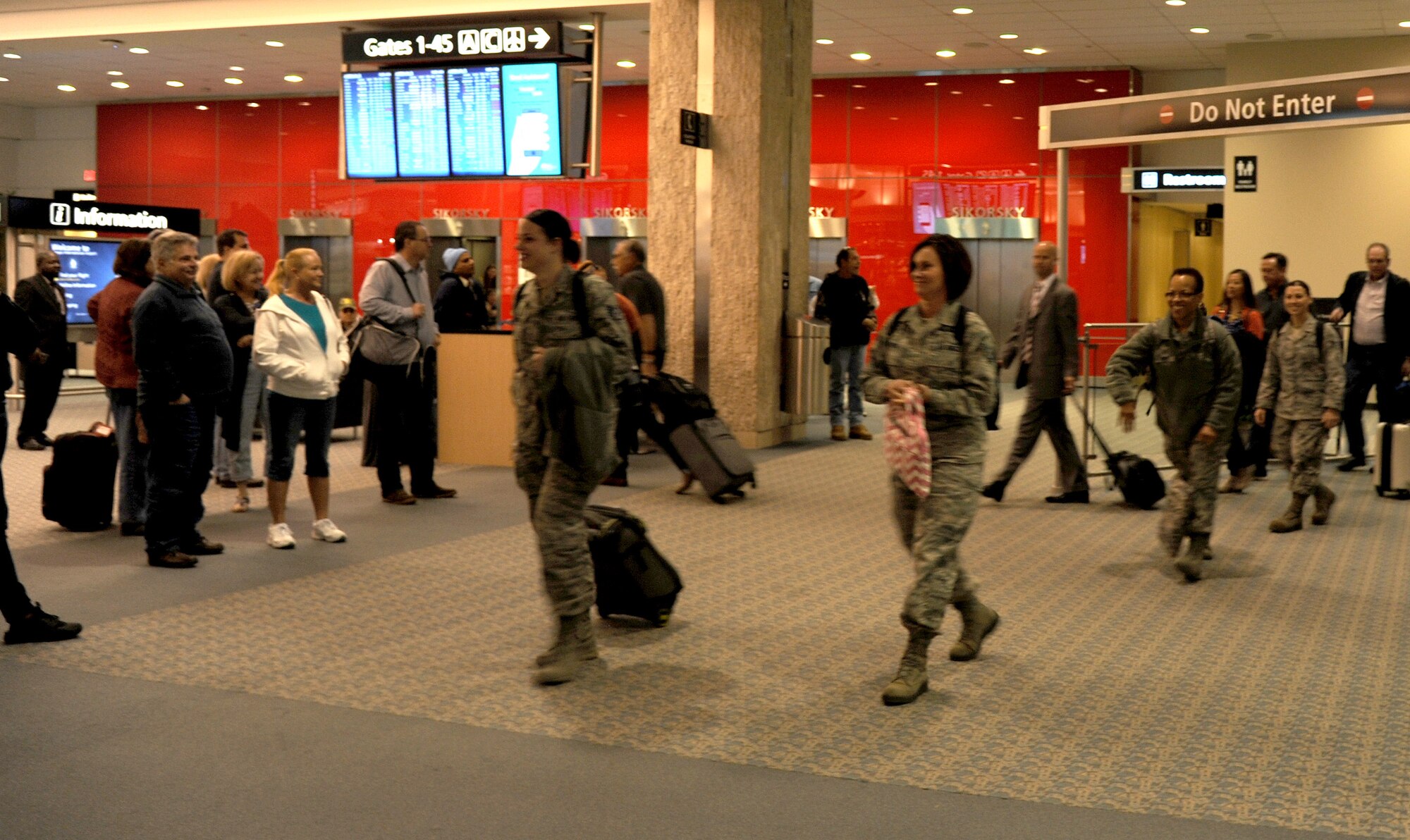 Members of the 45th Aeromedical Evacuation Squadron arrive home on Feb. 5, 2016 at Tampa International Airport. Personnel arrived after serving four months overseas, assisting injured service men and women. (U.S. Air Force photo by Tech. Sgt. Peter Dean) 