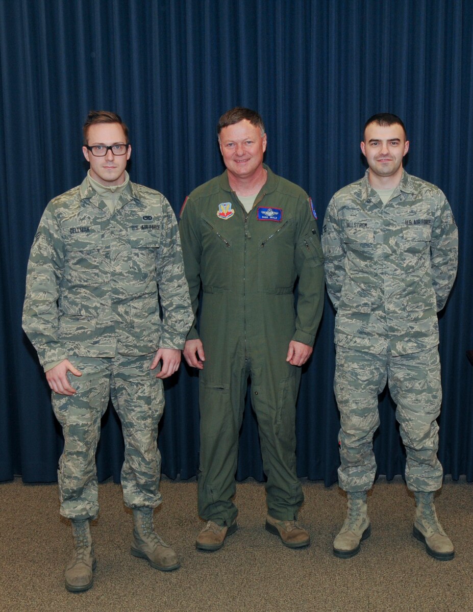 Staff Sgt. Ethan Dellman,114th Maintenance Squadron ammunitions, and Staff Sgt. Zach Hollstrom, 114th Operation Support Squadron aviation resource management, received recognition from Col. Russ Walz, 114th Fighter Wing commander, during a ceremony held at Joe Foss Field, S.D. Jan. 10, 2016.  Both Airmen received the Distinguished Graduate award at Airman Leadership School.  This award is given to Airmen who graduate in the top 10 percent of their class. (U.S. Air National Guard photo by Staff Sgt. Duane Duimstra)