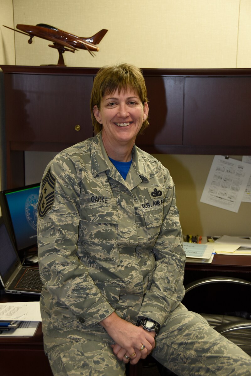 Chief Master Sgt. Jeanne Gacke pauses for a photo at Joe Foss Field S.D. Feb 7 2016.  Gacke was selected at the new State Command Chief for the South Dakota Air National Guard. She is the first female to hold this position in the South Dakota Air National Guard.(U.S. Air National Guard photo by Tech. Sgt. Christopher Stewart/Released)