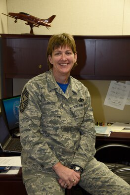 Chief Master Sgt. Jeanne Gacke pauses for a photo at Joe Foss Field S.D. Feb 7 2016.  Gacke was selected at the new State Command Chief for the South Dakota Air National Guard. She is the first female to hold this position in the South Dakota Air National Guard.(U.S. Air National Guard photo by Tech. Sgt. Christopher Stewart/Released)
