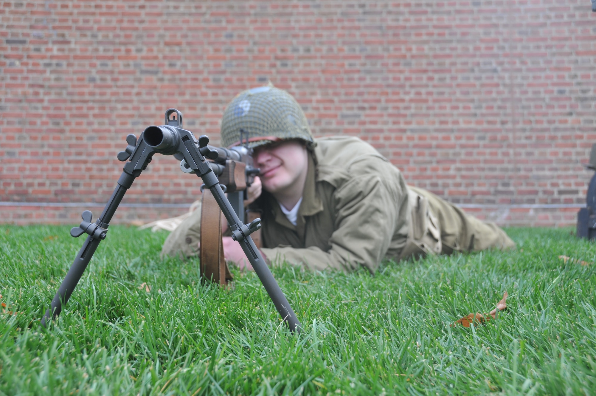 A reenactor from World War II prepares to fire his weapon. The Pennsylvania National Guard joined with the Pennsylvania Department of Conservation of Natural Resources' Point State Park and the Association of the United States Army to organize Steel City Salutes the Troops, Pittsburgh, Nov. 7, 2015. (U.S. Air National Guard Photo by Staff Sgt. Ryan Conley)