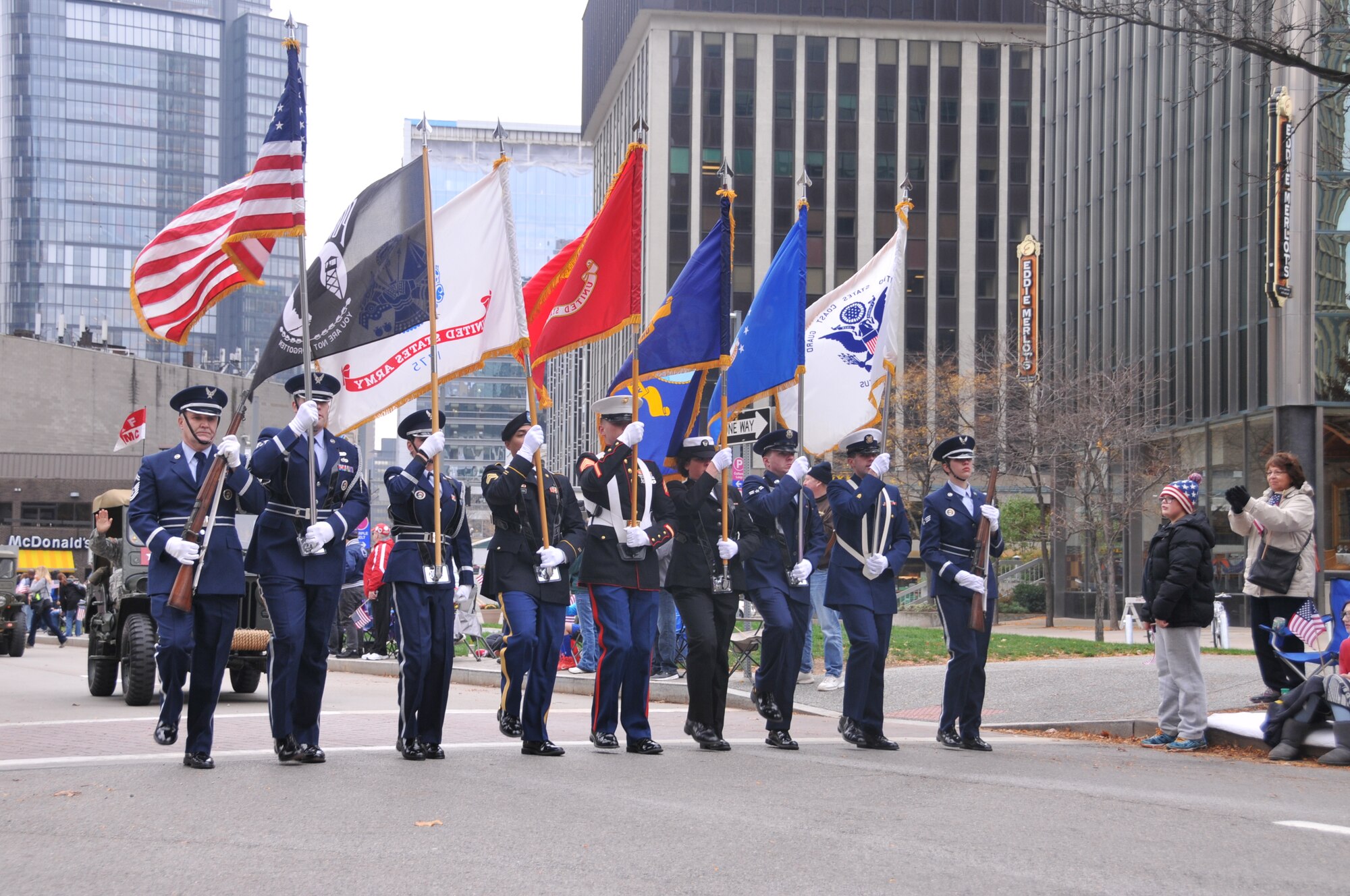 A joint service color guard, including members of the 171st Air Refueling Wing, march in the Veterans' Parade. The Pennsylvania National Guard joined with the Pennsylvania Department of Conservation of Natural Resources' Point State Park and the Association of the United States Army to organize Steel City Salutes the Troops, Pittsburgh, Nov. 7, 2015.  (U.S. Air National Guard Photo by Staff Sgt. Ryan Conley)
