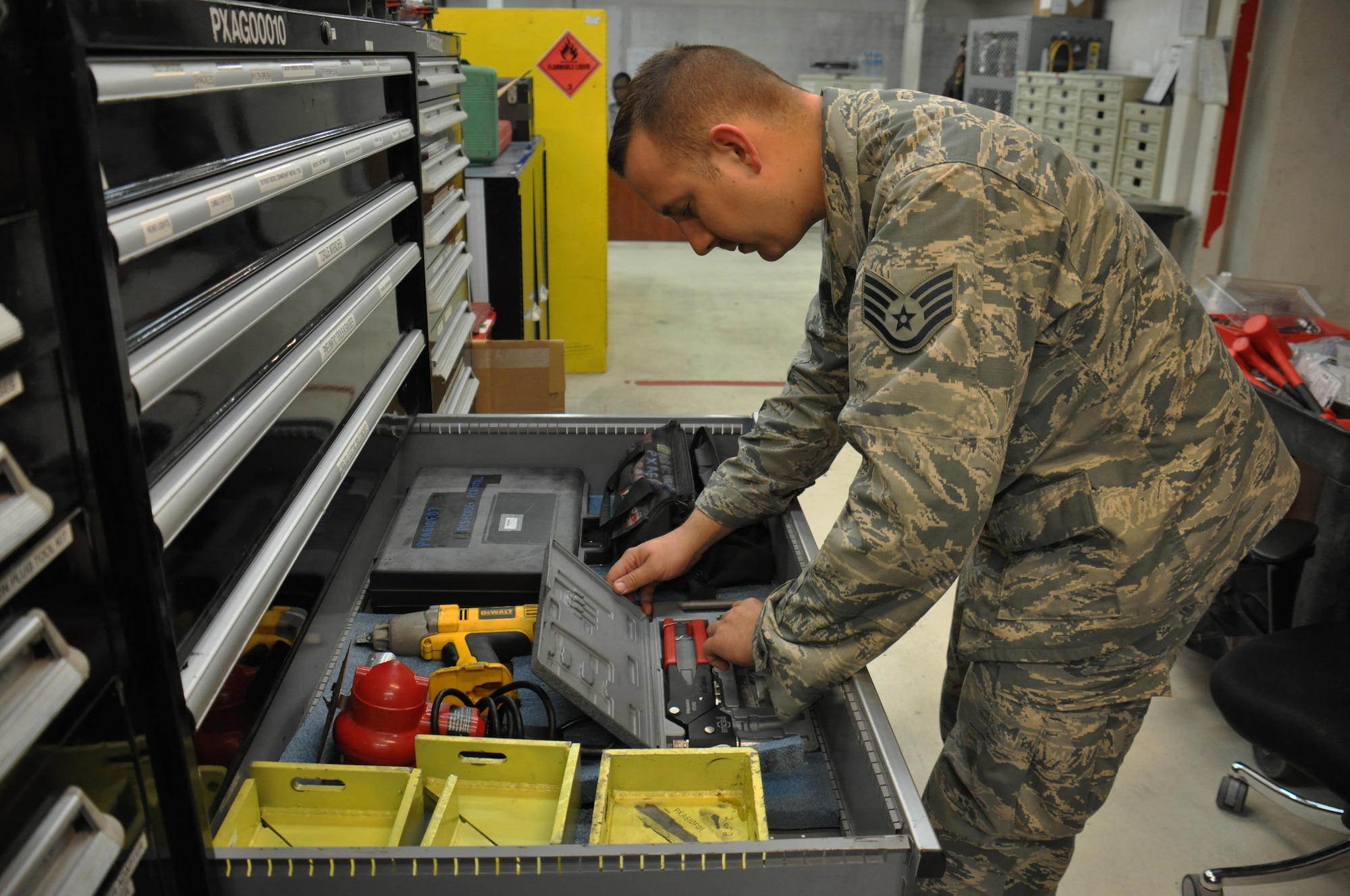 Staff Sgt. Kenneth Roman, 379th Expeditionary Maintenance Squadron Aerospace Ground Equipment Flight journeyman from Charlotte, North Carolina, inventories tools inside the AGE facility at Al Udeid Air Base, Qatar, Feb. 4. Roman is responsible for nearly 700 tools and parts including hammers, sockets and drills. The flight maintains tools and equipment valued at $32 million. (U.S. Air Force photo by Tech. Sgt. James Hodgman/Released)