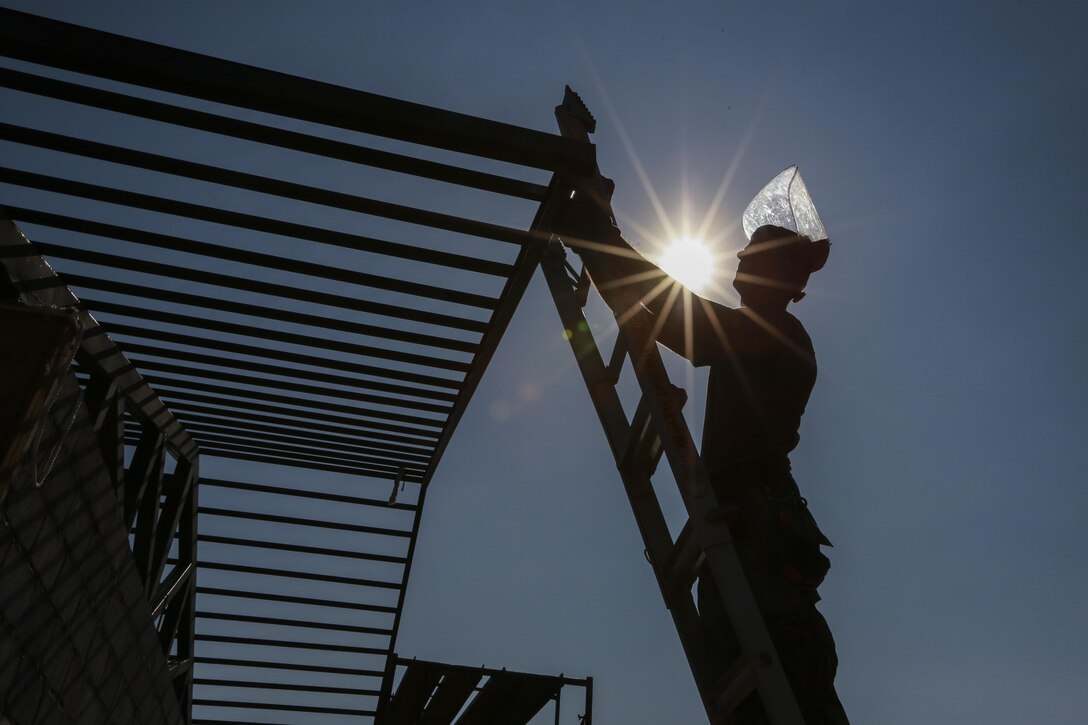 U.S. Navy Petty Officer 2nd Class Dylan Perrin, steel worker, with Naval Mobile Construction Battalion 3, cuts steel beams during the construction of a community center at the Ban Sa Yai School, in Trat, Thailand, during exercise Cobra Gold, Feb. 3, 2016. Cobra Gold 2016, in its 35th iteration, includes a specific focus on humanitarian civic action, community engagement, and medical activities conducted during the exercise to support the needs and humanitarian interests of civilian populations around the region.