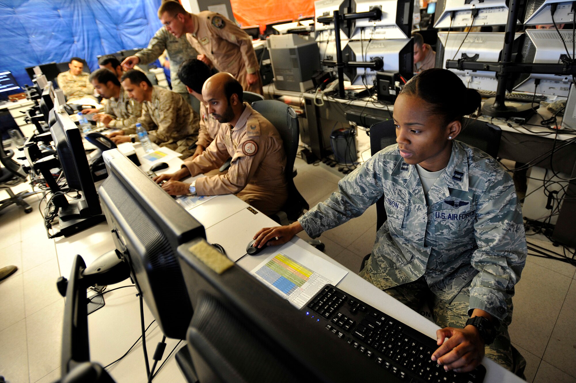 Capt. Mechell Dotson serves as the host nation Air Operations Center liaison during Arabian Gulf Shield, Feb. 3, 2016, at the Combined Air Operations Center, Al Udeid Air Base, Qatar. Arabian Gulf Shield is the culminating exercise for the Gulf Cooperation Council (GCC) Liaison Officer (LNO) Program. The exercise is designed to exercise GCC LNO procedures and connectivity to host nation Air Operations Centers which improves US-GCC interoperability. (U.S. Air Force photo by Master Sgt. Joshua Strang)