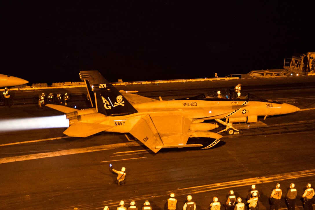 (Dec. 28, 2015) An F/A-18F Super Hornet, assigned to the "Jolly Rogers" of Strike Fighter Squadron (VFA) 103, launches from the flight deck of the aircraft carrier USS Harry S. Truman (CVN 75). The Harry S. Truman Carrier Strike Group is deployed in support of maritime security operations and theater security cooperation efforts in the U.S. 5th Fleet area of operations.