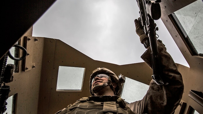 Lance Cpl. Andrew Metler, a mortarman with Bravo Company, 1st Battalion, 7th Marine Regiment, Special Purpose Marine Air Ground Task Force-Crisis Response-Central Command, mans the turret gun of a Humvee during a patrol in Al Taqaddum, Iraq, Jan. 1, 2016. U.S. Marines with SPMAGTF-CR-CC are responsible for the force protection of some Combined Joint Task Force – Operation Inherent Resolve bases within the U.S. Central Command area of responsibility.