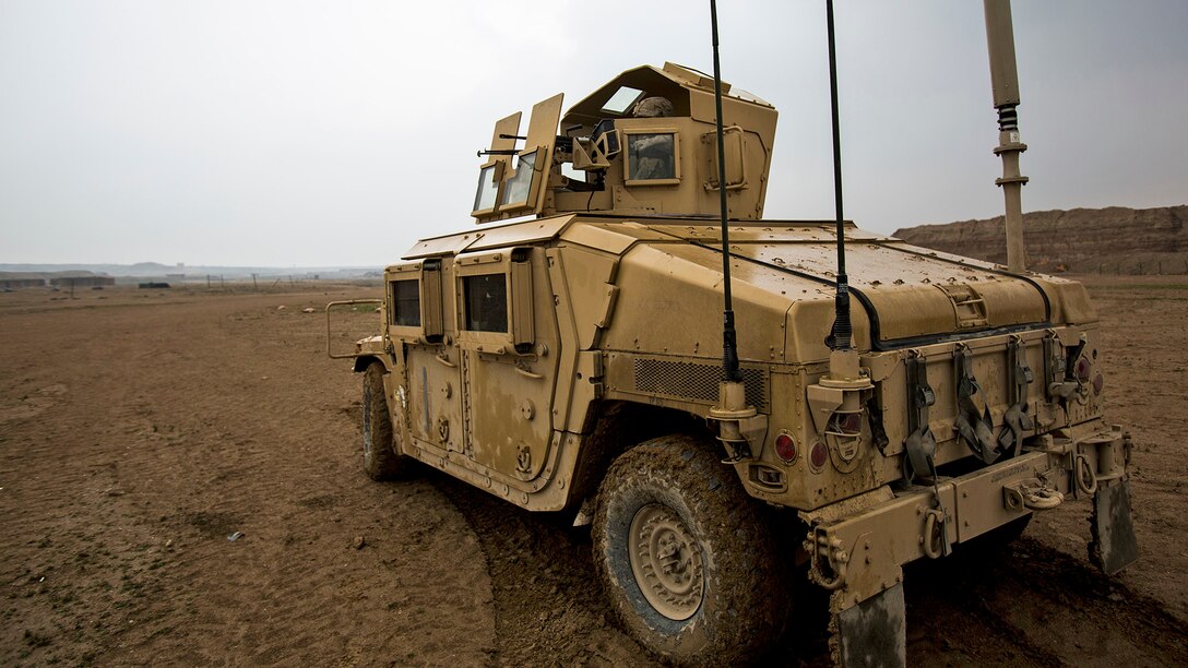 U.S. Marines with Bravo Company, 1st Battalion, 7th Marine Regiment, Special Purpose Marine Air Ground Task Force-Crisis Response-Central Command, conduct a mounted patrol in Al Taqaddum, Iraq, Jan. 1, 2016. U.S. Marines with SPMAGTF-CR-CC are responsible for the force protection of some Combined Joint Task Force – Operation Inherent Resolve bases within the U.S. Central Command area of responsibility.