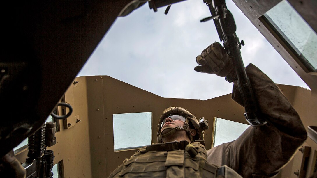 Lance Cpl. Andrew Metler, a mortarman with Bravo Company, 1st Battalion, 7th Marine Regiment, Special Purpose Marine Air Ground Task Force-Crisis Response-Central Command, mans the turret gun of a Humvee during a patrol in Al Taqaddum, Iraq, Jan. 1, 2016. U.S. Marines with SPMAGTF-CR-CC are responsible for the force protection of some Combined Joint Task Force – Operation Inherent Resolve bases within the U.S. Central Command area of responsibility.