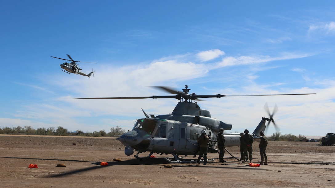 Marines with Marine Light Attack Helicopter Squadron 267 land a UH-1Y Huey to refuel during exercise Scorpion Fire 1-16 on Navy Air Facility El Centro, Calif., Jan. 25, 2016. HMLA-267 supported the exercise with close air support and live-fire capabilities, Jan. 25 to Feb. 5, 2016.