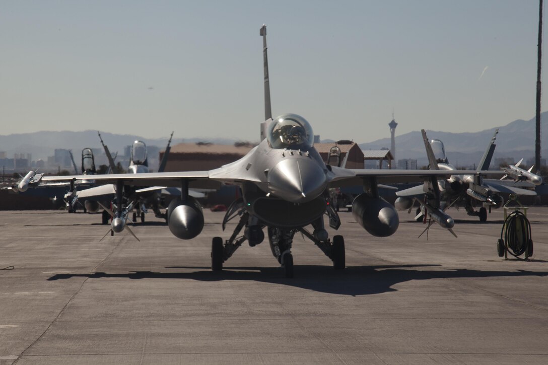An F-16 Fighting Falcon aircraft is parked on the flightline during exercise Red Flag 16-1 on Nellis Air Force Base, Nev., Jan. 26, 2016. Air Force photo by Master Sgt. Burt Traynor
