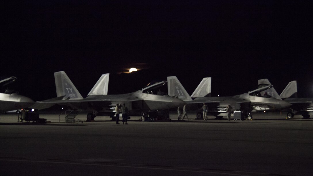 Airmen prepare F-22 Raptor aircraft for a night training sortie during exercise Red Flag 16-1 on Nellis Air Force Base, Nev., Jan. 26, 2016. The airmen are assigned to the 95th Fighter Squadron. Twelve F-22s and more than 200 airmen deployed from Tyndall Air Force Base, Fla., are participating in Red Flag 16-1. Air Force photo by Master Sgt. Burt Traynor 