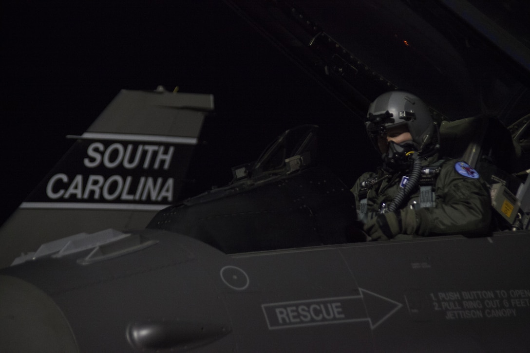 An F-16 Fighting Falcon pilot conducts a pre-flight check during exercise Red Flag 16-1 on Nellis Air Force Base, Nev., Jan. 26, 2016. Air Force photo by Master Sgt. Burt Traynor 