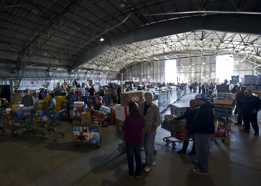 Lines formed at the register and to get inside the commissary case lot sale at Duke Field, Fla., Feb. 6. Patrons waited in line for at least 30 minutes to receive the special sales prices. The two-day sale was open to military, retirees, family members and had special hours for reservists. (U.S. Air Force photo/Tech. Sgt. Sam King)