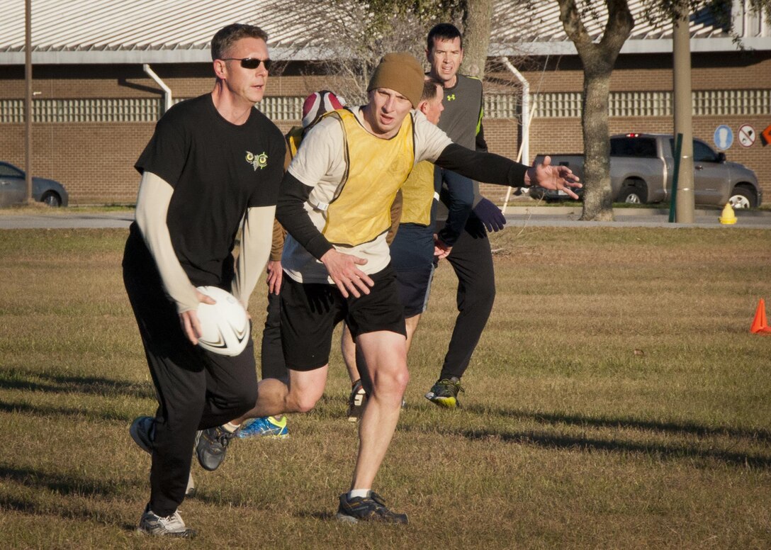 Members of the Air Force Special Operations Air Warfare Center joined 919th Special Operations Wing Airmen in the near freezing temperatures for an ultimate rugby team-building event at Duke Field, Fla., Feb. 5.  (U.S. Air Force photo/Dan Neely)