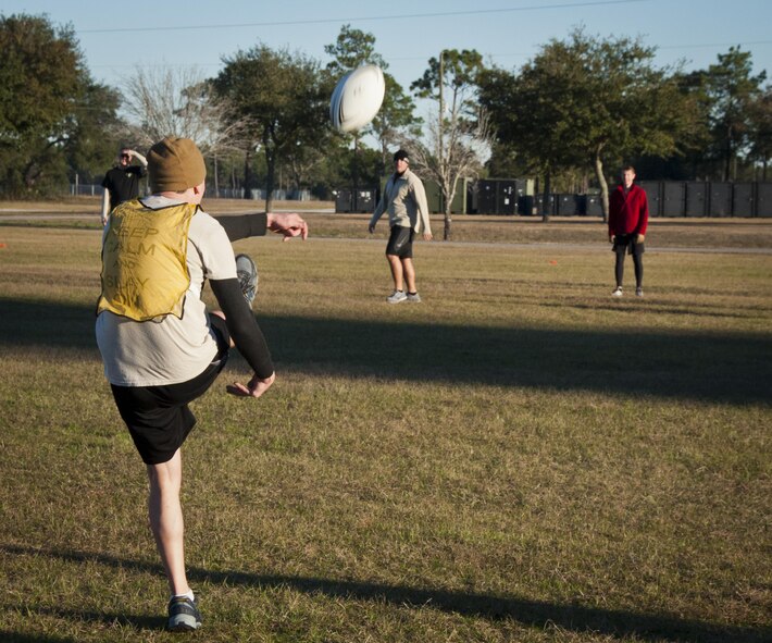 Members of the Air Force Special Operations Air Warfare Center joined 919th Special Operations Wing Airmen in the near freezing temperatures for an ultimate rugby team-building event at Duke Field, Fla., Feb. 5.  (U.S. Air Force photo/Dan Neely)