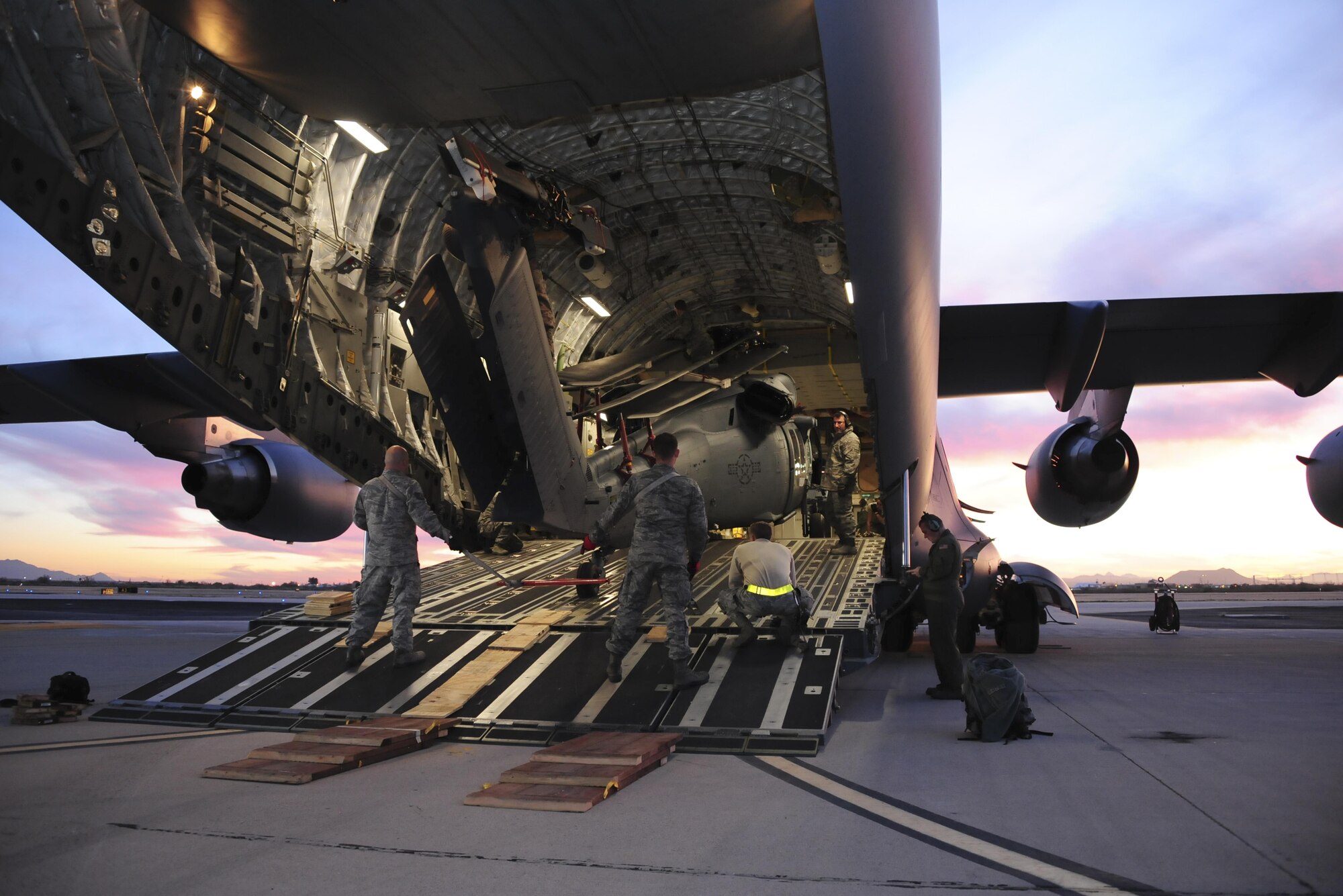 Airmen offload an HH-60 from a C-17 from March Air Reserve Base, Calif., Jan. 28 after it delivered the Air Force Reserve Command's first HH-60 to go through Korean Air Lines depot maintenance. During this intensive overhaul, the helicopter is stripped down to nothing and they fix any corrosion before putting it back together so that it’s as fresh as the day it came off the assembly line. “By using KAL, we were able to save both time and money compared to using a stateside depot,” said Maj. Dusty Dossman, 943rd Maintenance Squadron commander. (U.S. Air Force photo by Senior Airman Christopher Drzazgowski)
