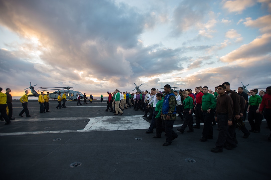 Sailors participate in a foreign object debris walk down on the USS John C. Stennis flight deck in the Pacific Ocean, Jan. 28, 2016. Navy photo by Seaman Cole C. Pielop    