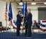 Maj. Gen. Stayce D. Harris, 22nd Air Force commander, Dobbins Air Reserve Base, Georgia,  passes the 914th Airlift Wing flag to Col. Brian S. Bowman as he assumes command of the wing at Niagara Falls Air Reserve Station, N.Y., Feb. 6. (U.S. Air Force photo by Tech. Sgt. Stephanie Sawyer) 
