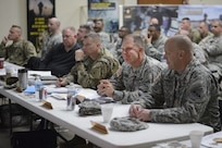 General officers sit in the first row and listen to a speech by Army Sgt. 1st. Class Stacy Muse, the Army Reserve operations noncommissioned officer in charge.  Recruiters gathered around the Armed Forces Reserve Center in Forest Park, Ill., Jan. 9, 2016.
