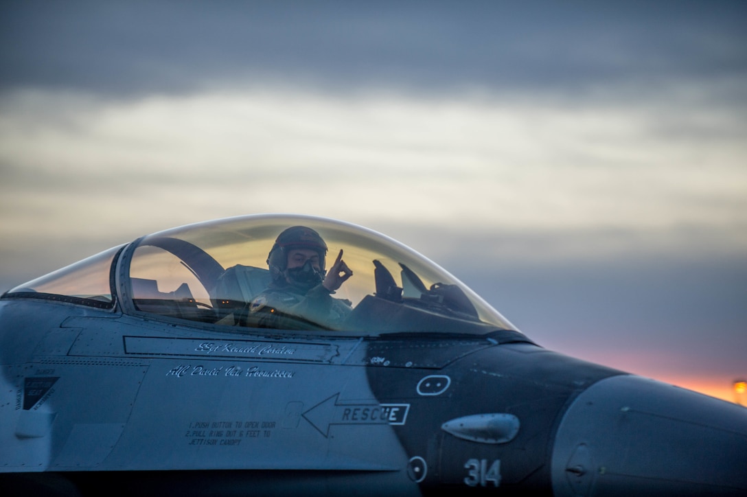 Air Force Capt. Todd Possemato taxis an F-16 Fighting Falcon aircraft to the flightline on Eielson Air Force Base, Alaska, Jan. 24, 2016, to fly to Kadena Air Base, Japan, to participate in training exercises. Possemato is a pilot assigned to the 18th Aggressor Squadron. Air Force photo by Staff Sgt. Shawn Nickel