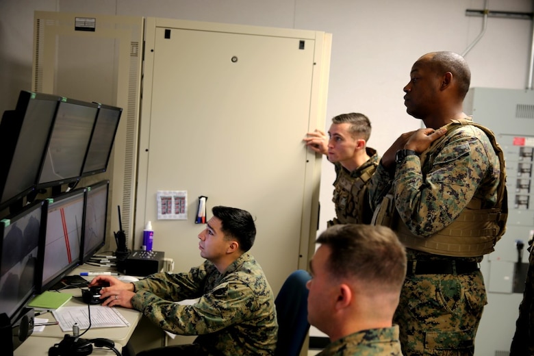 Marines with 5th Battalion, 11th Marine Regiment, 1st Marine Division, coordinate obstacles for the Marines to face in a Combat Convoy Simulator, aboard Marine Corps Base Camp Pendleton, Feb. 2, 2016. The CCS at first glance looks like an expensive, high-tech video game, but its primary use is preparing Marines for real-world combat missions with simulations of realistic scenarios.