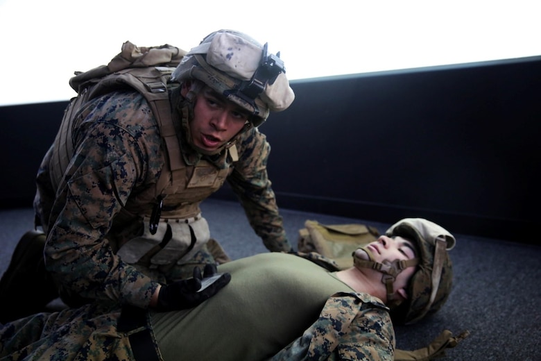 Marines with 5th Battalion, 11th Marine Regiment, 1st Marine Division, rehearse procedures for assessing and treating combat injuries in a Combat Convoy Simulator aboard Marine Corps Base Camp Pendleton, Feb. 2, 2016. The CCS at first glance looks like an expensive, high-tech video game, but its primary use is preparing Marines for real-world combat missions with simulations of realistic scenarios.