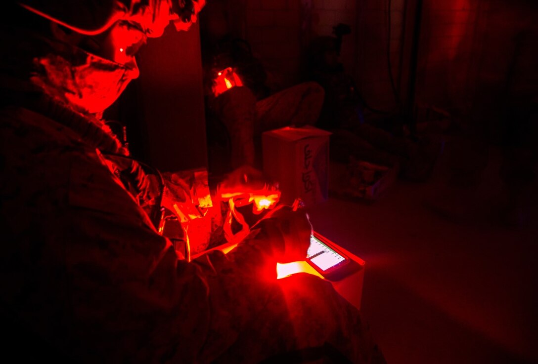 U.S. Marine Corps Capt. William Brown, foward air controller, with 1st Air Naval Gunfire Liason Company, Special Purpose Marine Air-Ground Task Force-Crisis Response-Central Command (SPMAGTF-CR-CC), plots simulated targets during exercise Eager Centaur in an undisclosed location, Southwest Asia, Feb. 1, 2016. Eager Centaur is conducted to complete initial joint terminal attack controller training and exercise the MAGTF Fire Support Coordination Center, to include combined arms live fire tactics, techniques and procedures. (U.S. Marine Corps photo by Cpl. Akeel Austin/Released)
