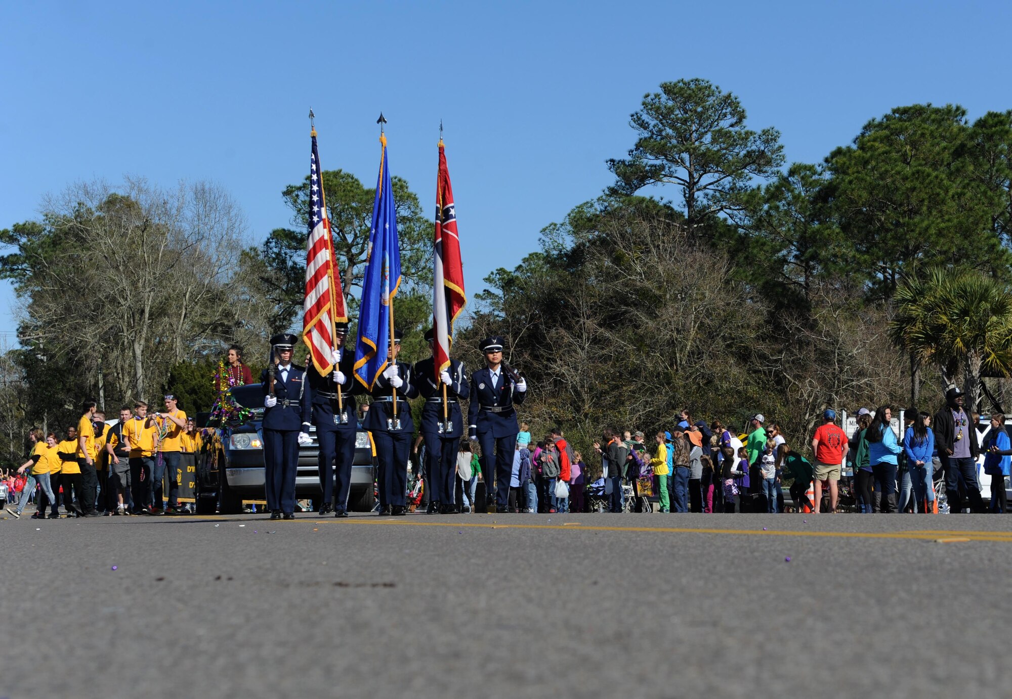 Members of the Keesler Air Force Base Honor Guard lead the North Bay Area Mardi Gras Parade Feb. 7, 2016, St. Martin, Miss. Every Mardi Gras season, Keesler participates in local parades to be involved with the community. (U.S. Air Force photo by Kemberly Groue)