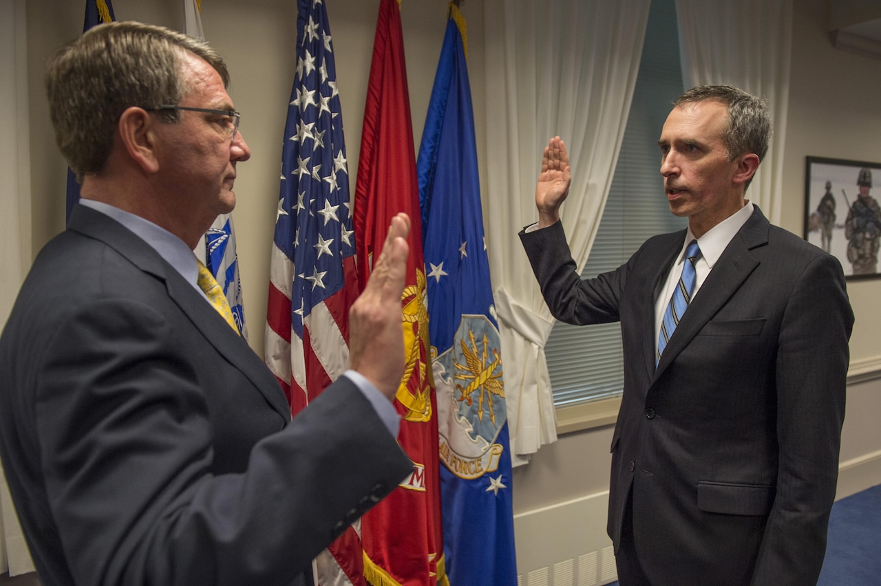 Defense Secretary Ash Carter, left, swears in Marcel Lettre as the undersecretary of defense for intelligence during a ceremony at the Pentagon, Feb. 5, 2016. Confirmed by the Senate in December 2015, Lettre serves as the principal intelligence advisory to the secretary, and exercises authority over all Defense Department intelligence and security organizations. Lettre also oversees 110,000 personnel as well as defense intelligence components, including the Military Intelligence Program, the defense portion of the National Intelligence Program and intelligence interests within the Battlespace Awareness portfolio. He is the department’s principal contact for the CIA, and represents the department on intelligence and sensitive operations at the National Security Council. DoD photo by Senior Master Sgt. Adrian Cadiz
