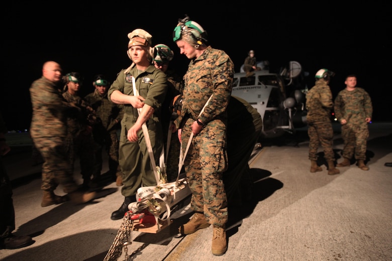 Marines with Marine Heavy Helicopter Squadron 464 load a CH-53E Super Stallion onto a C-5 Galaxy in preparation for Operation Cold Response 2016 at Marine Corps Air Station Cherry Point, N.C., Feb. 3, 2016. The key purpose of Cold Response is to train and educate participants on how to conduct combat operations in a cold weather environment. Up to 2,000 Marines and 15,000 military personnel from 14 nations will attend the North Atlantic Treaty Organization-level exercise. (U.S. Marine Corps photo by Pfc. Nicholas P. Baird/Released)