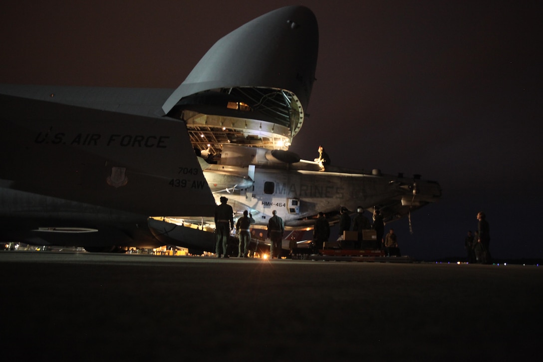 Marines with Marine Heavy Helicopter Squadron 464 load a CH-53E Super Stallion onto a C-5 Galaxy in preparation for Operation Cold Response 2016 at Marine Corps Air Station Cherry Point, N.C., Feb. 3, 2016. The key purpose of Cold Response is to train and educate participants on how to conduct combat operations in a cold weather environment. Up to 2,000 Marines and 15,000 military personnel from 14 nations will attend the North Atlantic Treaty Organization-level exercise. (U.S. Marine Corps photo by Pfc. Nicholas P. Baird/Released)