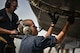Airman 1st Class Bobby Baker and Brian Allen, 37th Aircraft Maintenance Unit crew chiefs, read through their technical orders during preventative maintenance on a B1-B Lancer Sept. 22, 2015 at Al Udeid Air Base, Qatar. Baker and Allen are deployed from Ellsworth Air Force Base, S.D. (U.S. Air Force photo/Staff Sgt. Alexandre Montes)