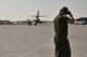 Staff Sgt. Bryant Reinert, 37th Aircraft Maintenance Unit crew chief, watches as his B-1B Lancer moves towards the flightline for take-off Sept. 22, 2015 at Al Udeid Air Base, Qatar. Reinert is deployed out of Ellsworth Air Force Base, S.D. (U.S. Air Force photo/Staff Sgt. Alexandre Montes)