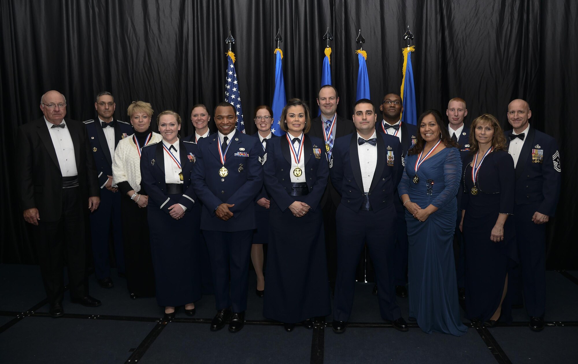 F.E. Warren Air Force Base 90th Missile Wing 2015 Annual Award winners pose with retired Maj. Gen. Thomas Deppe, guest speaker for the event; Col. Stephen Kravitsky, 90th MW commander; and Chief Master Sgt. Samuel Couch, 90th MW command chief, Feb. 5, 2016, in the Cheyenne, Wyo., Holiday Inn. Each year, winners of group-level yearly awards compete with each other for the wing-level award. (U.S. Air Force photo by Senior Airman Jason Wiese)