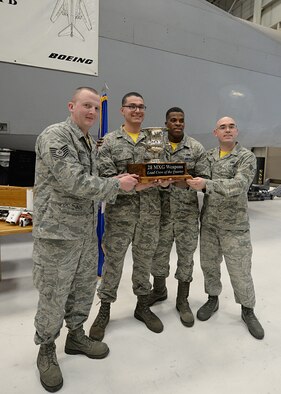 Airmen from 37th Aircraft Maintenance Unit clinched victory during a weapons load crew quarterly competition, Jan. 29.

Various load crews from the 28th Bomb Wing showcased their skills by racing against time to load explosives on a mock B-1 bomber accurately and safely.

"The competition shows how well we are prepared to load up a jet as fast and safely as we can to complete the mission that needs to be done," said Airman 1st Class Ignacio Luna, 28th Aircraft Maintenance Squadron weapons load crew member. "The biggest challenge we faced was that we were up against a crew that was far more experienced than we are, so we were the underdogs."

Though the 37th AMU were not favorites of the competition, they worked together and got the job done.

"Weapons load competitions build team work and unit camaraderie," said Tech. Sgt. Harold VanderMolen, 28th MXG loading standardization crew team chief. "They also provide the winning unit recognition for their hard work and the pride of showcasing the 28th BW Load Crew of the Quarter trophy in their unit."

The Loading Standardization Crew evaluates each load crew unit competing on performing safe and reliable weapons loading operations in accordance with B-1 bomber weapons loading technical orders, and Air Force instructions. The load crew members were required to load two 500 pound Mk-82 general purpose bombs, and one Guided Bomb Unit 31v3 within a strict 25-minute time standard.

VanderMolen added these competitions are serious business and crews dedicate time prior to ensure their best performance.

"Crews will come down to the Weapons Standardization area and practice the load," VanderMolen said. "They'll inspect the munitions and equipment prior to load competition day to ensure nothing will be missed. It's easy to read it in a book, but it is a whole different story actually performing it."

Though the event offers team and morale building, the competition tests the Airmen's knowledge and skills by pushi