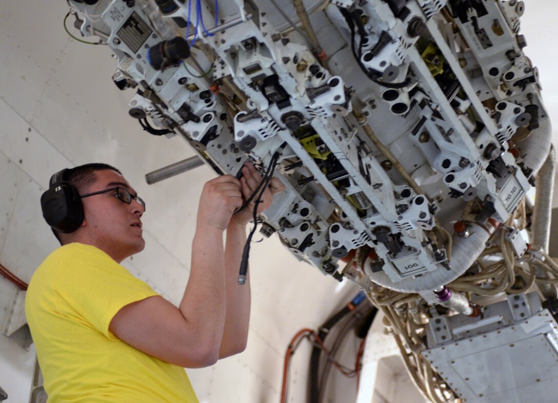 Airman 1st Class Ignacio Luna, 28th Aircraft Maintenance Squadron weapons load crew member, prepares a bomb bay for loading during a quarterly load crew competition at Ellsworth Air Force Base, S.D., Jan. 29, 2016. Once the aircraft is armed, weapons loaders execute quality checks to verify all weapons systems are operational proceeding to B-1 missions. (U.S. Air Force photo by Airman Donald Knechtel/Released)