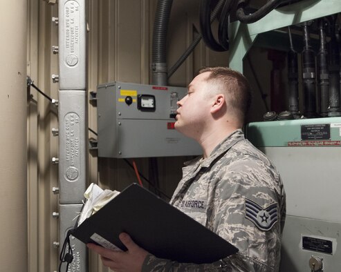 Staff Sgt. Jerimiah Jensen, 320th Missile Squadron facility manager, conducts a routine maintenance check in the launch control equipment building of a missile alert facility belonging to F.E. Warren Air Force Base, Jan. 28, 2016. Facility managers  keep missile alert facilities in operation order for the nuclear deterrent mission. (U.S. Air Force photo by Lan Kim)