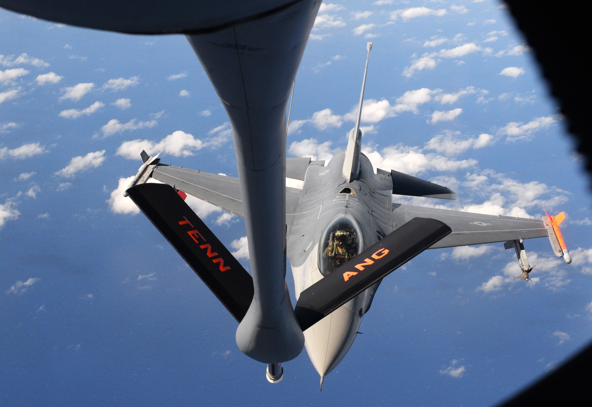 A F-16 Fighting Falcon, piloted by Maj. Peter Johnson, 36th Wing, prepares to receive fuel from a 134th Air Refueling Wing, Tennessee ANG KC-135 Stratotanker, Feb. 2, 2016, over the Pacific Ocean. The F-16 Fighting Falcon is a compact, multi-role fighter aircraft. It provides a relatively low-cost, high-performance weapon system for the United States and allied nations. (U.S. Air Force photo/Senior Airman Joshua Smoot)