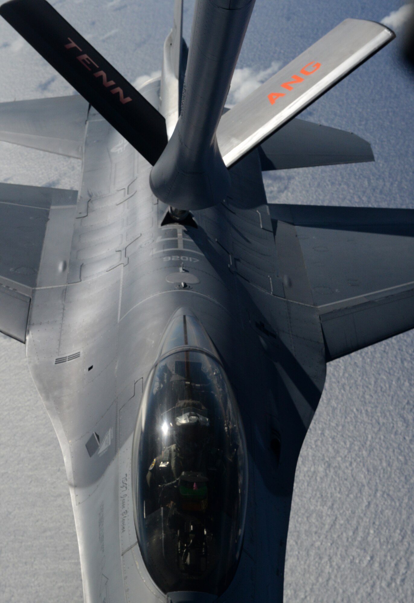 A F-16 Fighting Falcon, piloted by Capt. Jared Arnes, 112th Expeditionary Fighter Squadron, Ohio Air National Guard chief of training, receives fuel from a 134th Air Refueling Wing, Tennessee ANG KC-135 Stratotanker, Feb. 2, 2016, over the Pacific Ocean. The F-16 Fighting Falcon is a compact, multi-role fighter aircraft. It provides a relatively low-cost, high-performance weapon system for the United States and allied nations. (U.S. Air Force photo/Senior Airman Joshua Smoot)