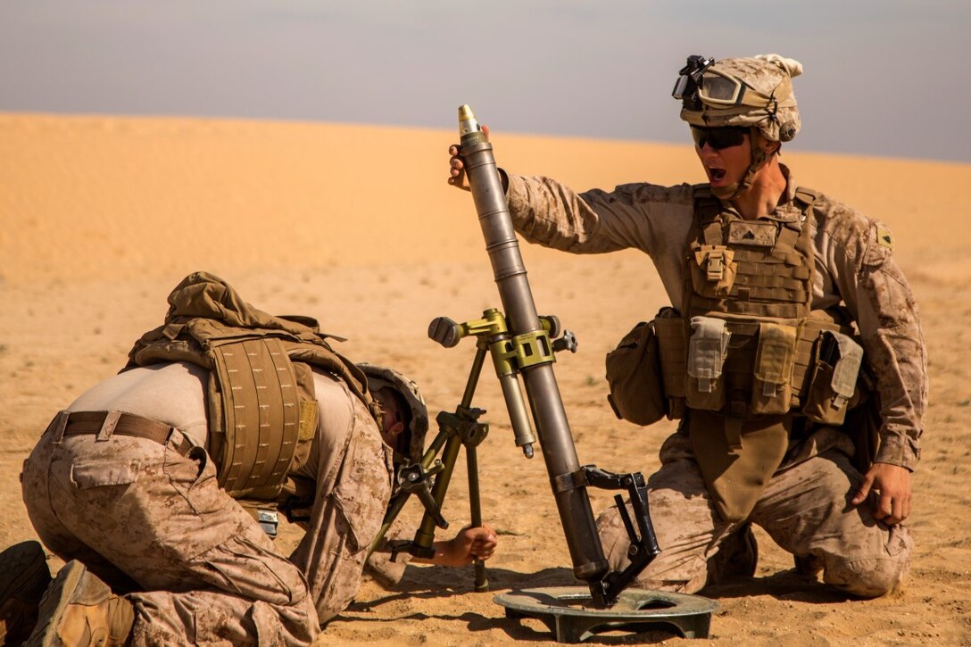 U.S. Marine Corps Cpl. Austin Miranda, mortarman, with Charlie Company, 1st Battalion 7th Marine Regiment, Special Purpose Marine Air-Ground Task Force-Crisis Response-Central Command (SPMAGTF-CR-CC), loads a 60mm mortar round during exercise Eager Centaur in an undisclosed location, Southwest Asia, Feb. 2, 2016. Eager Centaur is conducted to complete initial joint terminal attack controller training and exercise the MAGTF Fire Support Coordination Center, to include combined arms live fire tactics, techniques and procedures. (U.S. Marine Corps photo by Cpl. Akeel Austin/Released)
