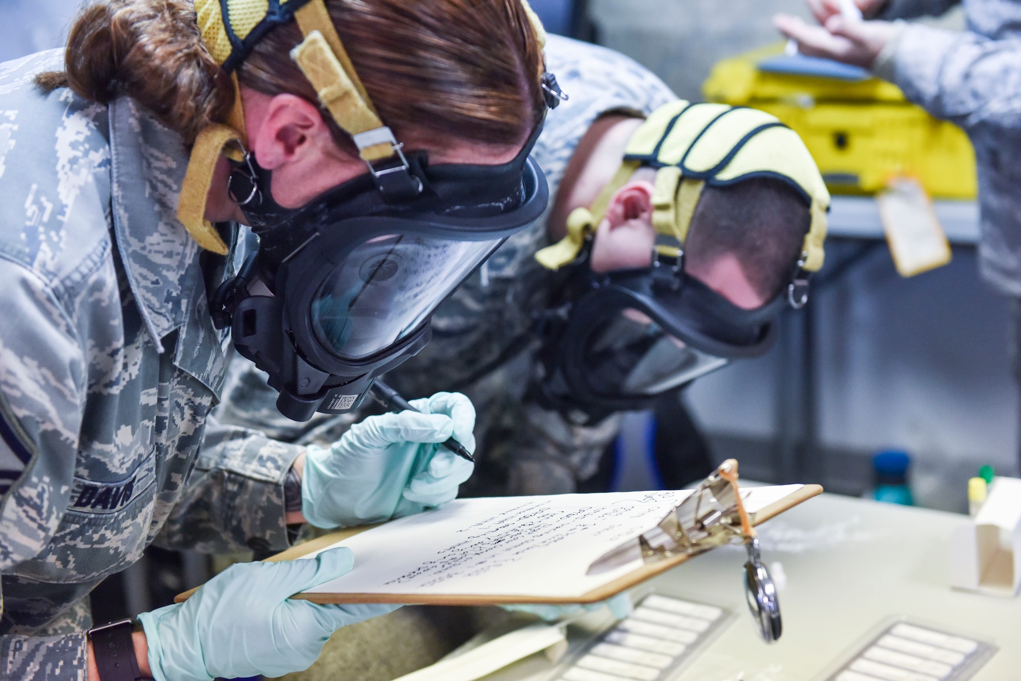 Master Sgt. Jessica E. Davis, emergency management NCOIC with the 911th Airlift Wing, and Airman Basic Jeffrey M. Guerriero, an emergency management specialist with the 911th Airlift Wing, work together to test and document results during biological response training, Coraopolis, Pennsylvania, Feb. 7, 2016. 911th Airlift Wing Reservists teamed up with their neighboring Air National Guard unit, the 171st Air Refueling Wing, to execute biological response training. (U.S. Air Force photo by Staff Sgt. Jonathan Hehnly)