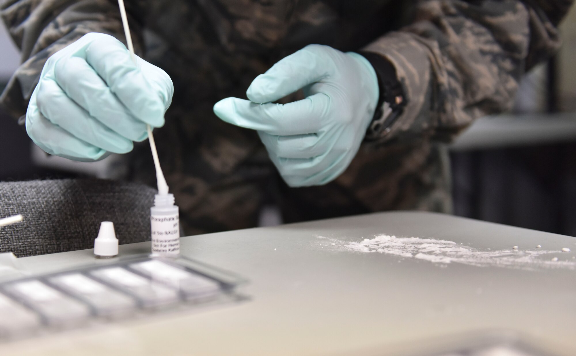 Airman Basic Jeffrey M. Guerriero, an emergency management specialist with the 911th Airlift Wing, uses a swab to test a powdery substance during biological response training, Coraopolis, Pennsylvania, Feb. 7, 2016. 911th Airlift Wing Reservists teamed up with their neighboring Air National Guard unit, the 171st Air Refueling Wing, to execute biological response training. (U.S. Air Force photo by Staff Sgt. Jonathan Hehnly)